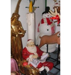 SANTA CLAUS SITTING WITH CANDLE